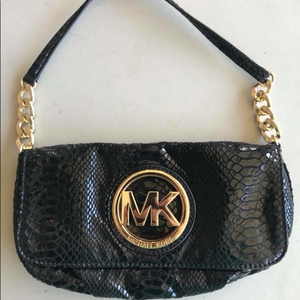 Michael Kors black and gold leather clutch.